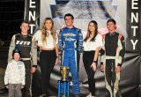 Keith Day Jr. stands proudly atop the podium after his first win at the Keller Auto Speedway Saturday night. 